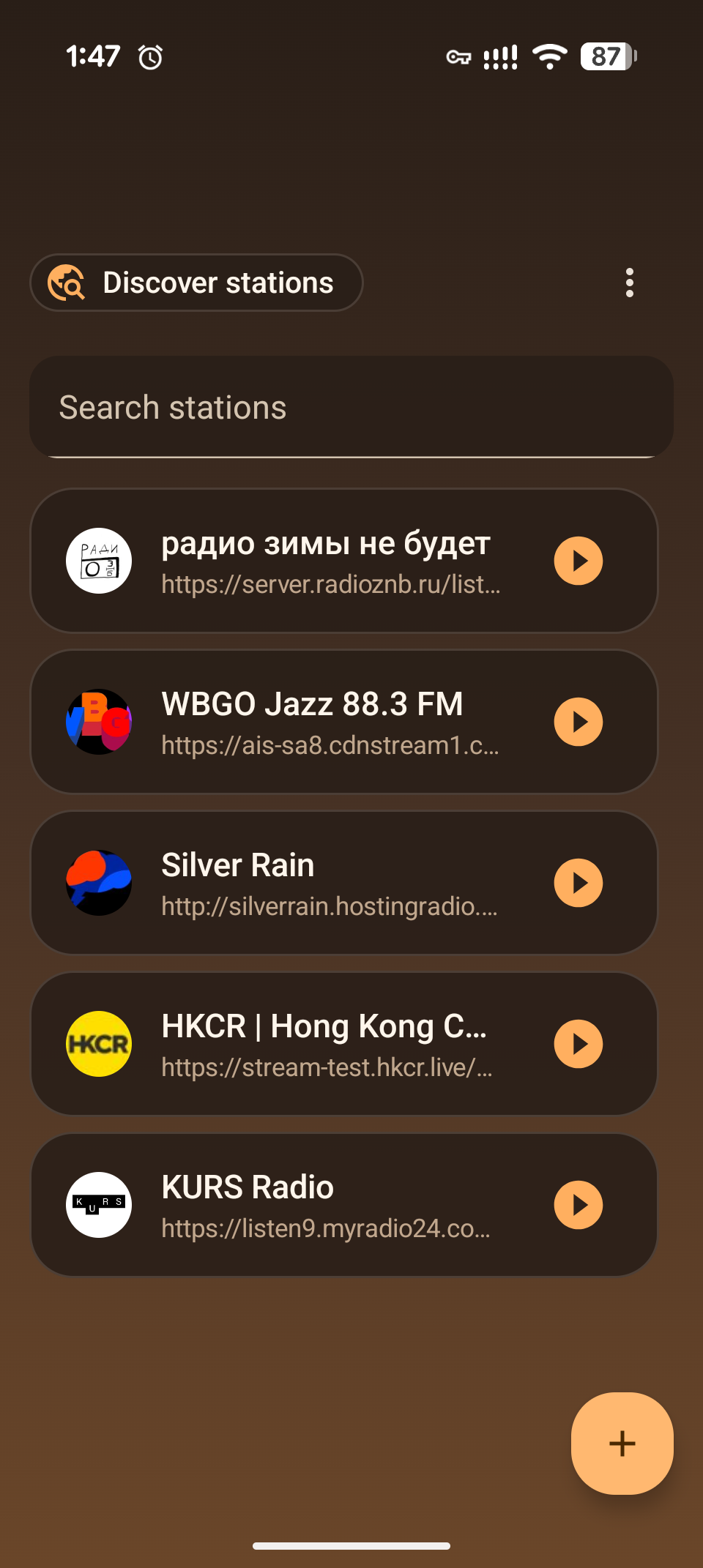 Freqcast library screen listing saved stations with play buttons and an add button